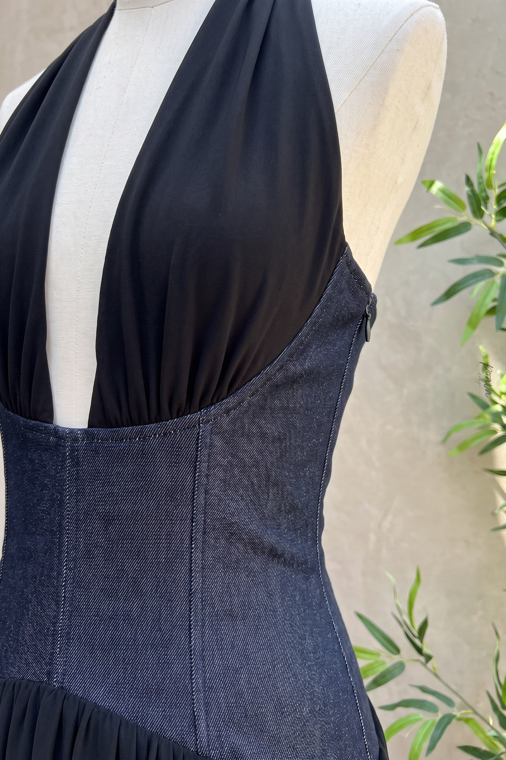 Black Two-Tone Halter Gown with Structured Corset Waist and High Slit Flowering Girl