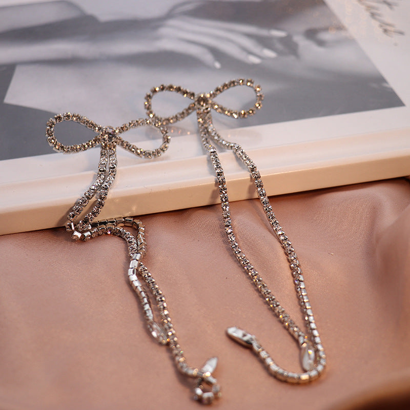 Rhinestone Bow Long Chain Earrings In White Flowering Girl