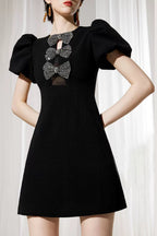 Vanessa Bow Puff Sleeve Mini Dress In Black Flowering Girl