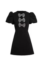 Vanessa Bow Puff Sleeve Mini Dress In Black Flowering Girl