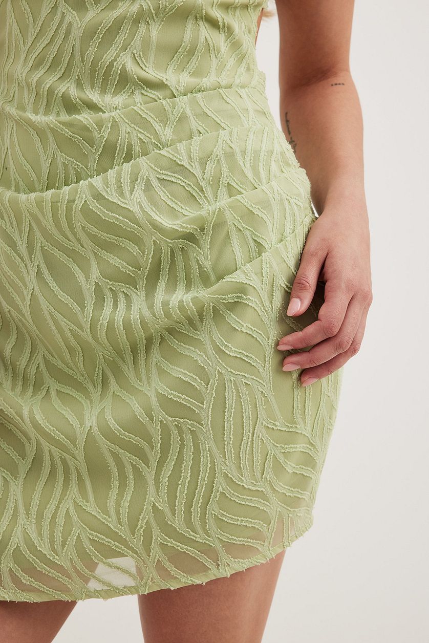 Structured Tie Back Mini Dress in green Flowering Girl